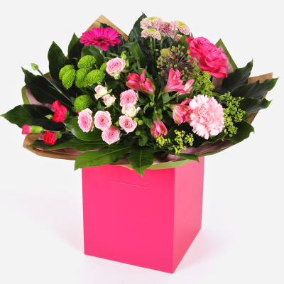 Petal Paradise - A lively bouquet featuring a bright mix of vibrant seasonal blooms.