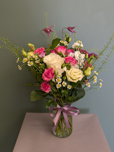 A pretty selection of seasonal flowers in a glass jam jar. - A pretty selection of seasonal flowers in a glass jam jar. Perfect for a little surprise!